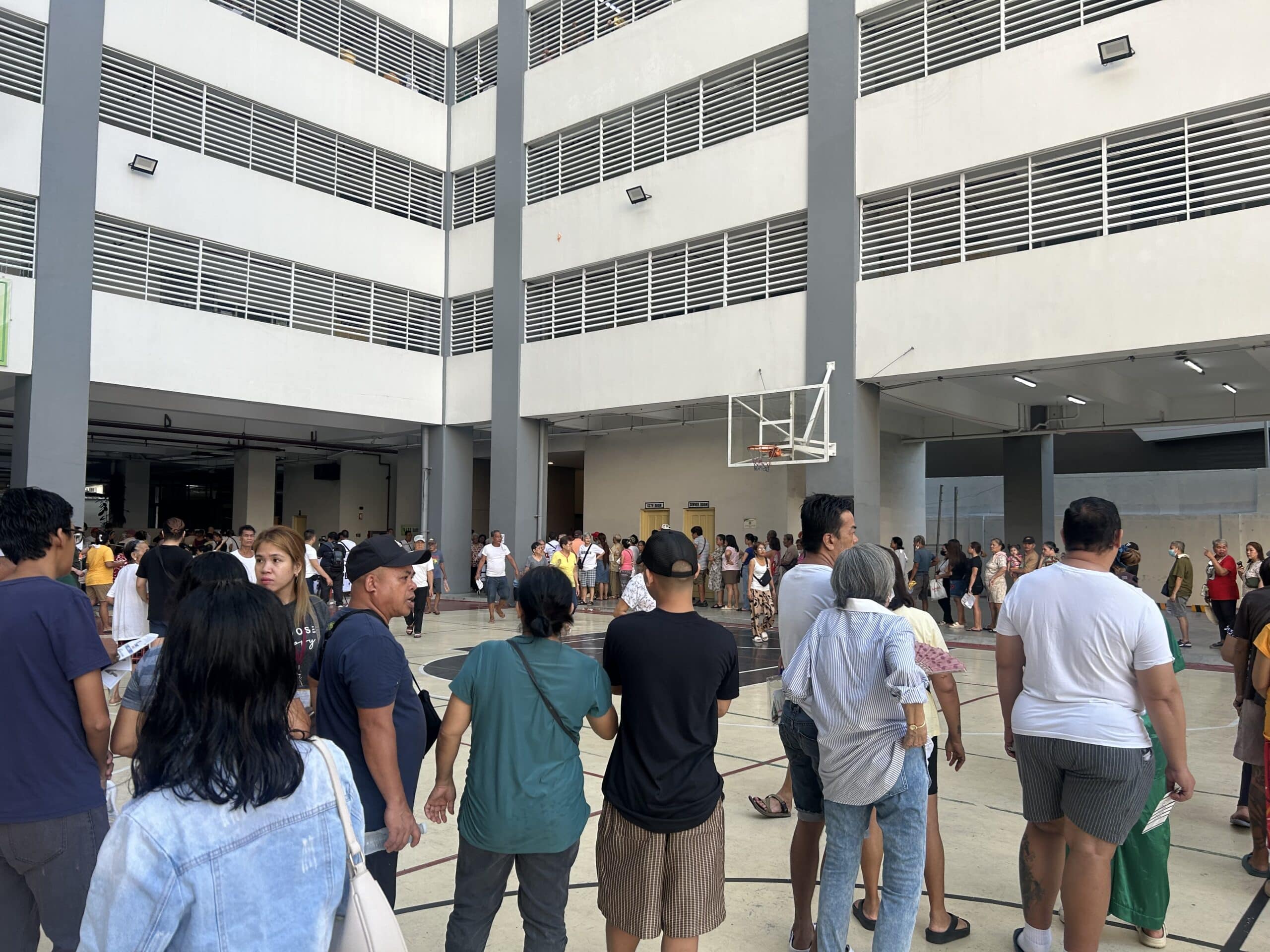 PHOTO: Long lines at the elevator await priority voters at Rosauro Almario Elementary School. FOR STORY: Priority voters wait for hours in some Manila poll places