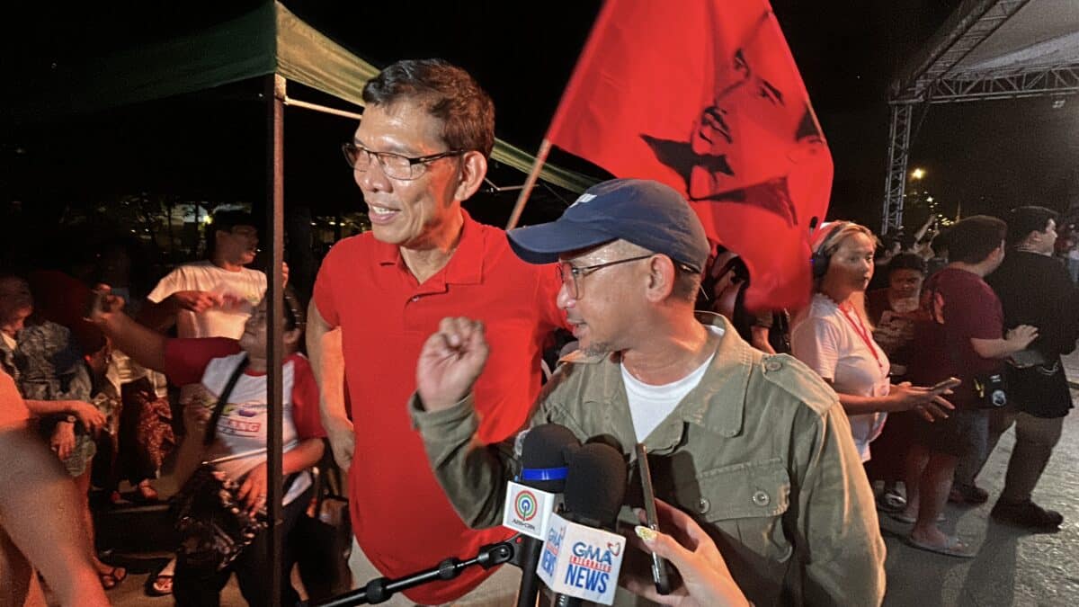 Partido Lakas ng Masa senatorial candidates and labor leaders Leody de Guzman (left) and Luke Espiritu (right) speak to the media in a chance interview after their miting de avance at the Liwasang Bonifacio in Manila on Friday night, May 9, 2025. — Photo by Jason Sigales/INQUIRER.net