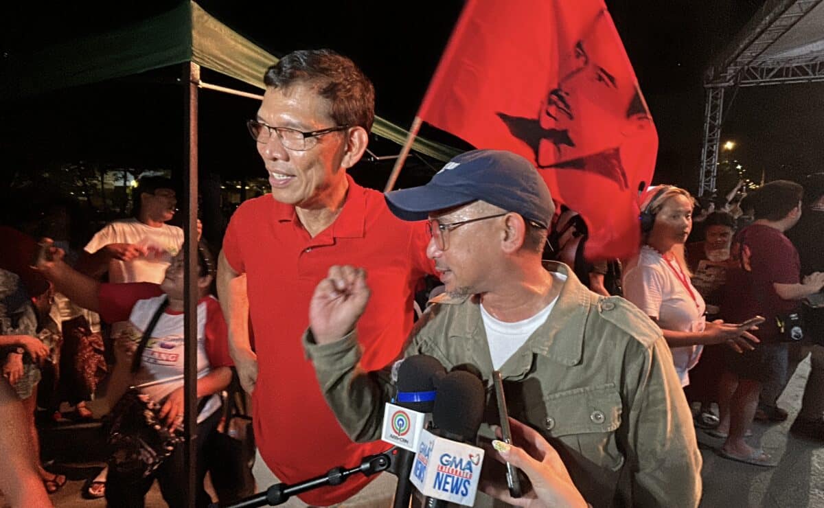 Partido Lakas ng Masa senatorial candidates and labor leaders Leody de Guzman (left) and Luke Espiritu (right) speak to the media in a chance interview after their miting de avance at the Liwasang Bonifacio in Manila on Friday night, May 9, 2025. — Photo by Jason Sigales/INQUIRER.net