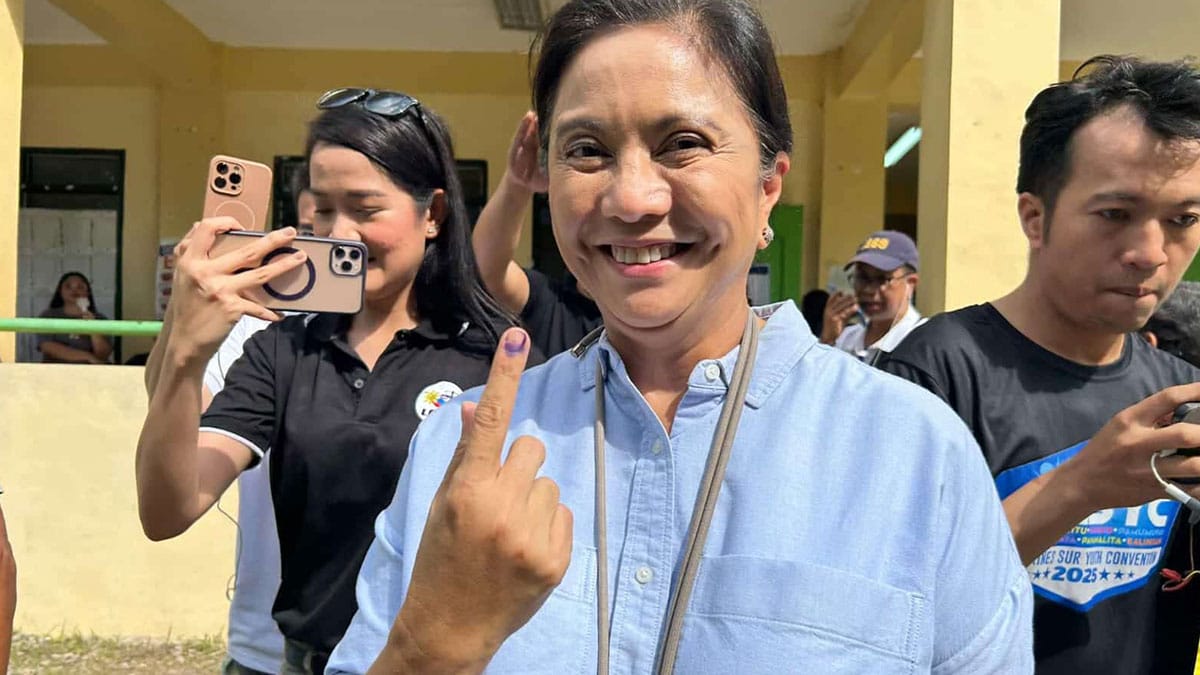 Showing her inked finger former Vice President and now Naga City mayoral candidates says she will focus on good governance and transparency if she wins the election. Photo by Michael B. Jaucian