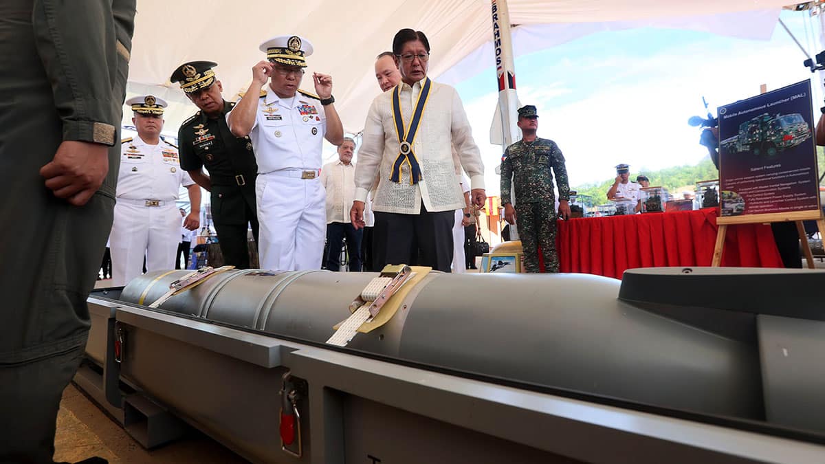‘MARITIME STRENGTH’ President Marcos, accompanied by Defense Secretary Gilberto Teodoro Jr. and Philippine Navy officials, inspects a torpedo shown on display at the Subic Naval Operating Base, where the President led the Navy’s commemoration of its 127th anniversary. —MARIANNE BERMUDEZ