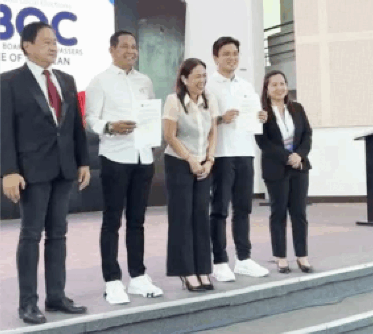 HISTORIC PROCLAMATION. Bulacan Governor Daniel Fernando (2nd left) and Vice Governor Alexis Castro (2nd right) stand with Provincial Board of Canvassers chair Atty. Mona Ann Campos (center) during their May 13, 2025 proclamation in Malolos City. Fernando's third-term victory with 1.16M votes sets a provincial record as Castro also won reelection with 1.36M votes. (PNA photo by Manny Balbin)
