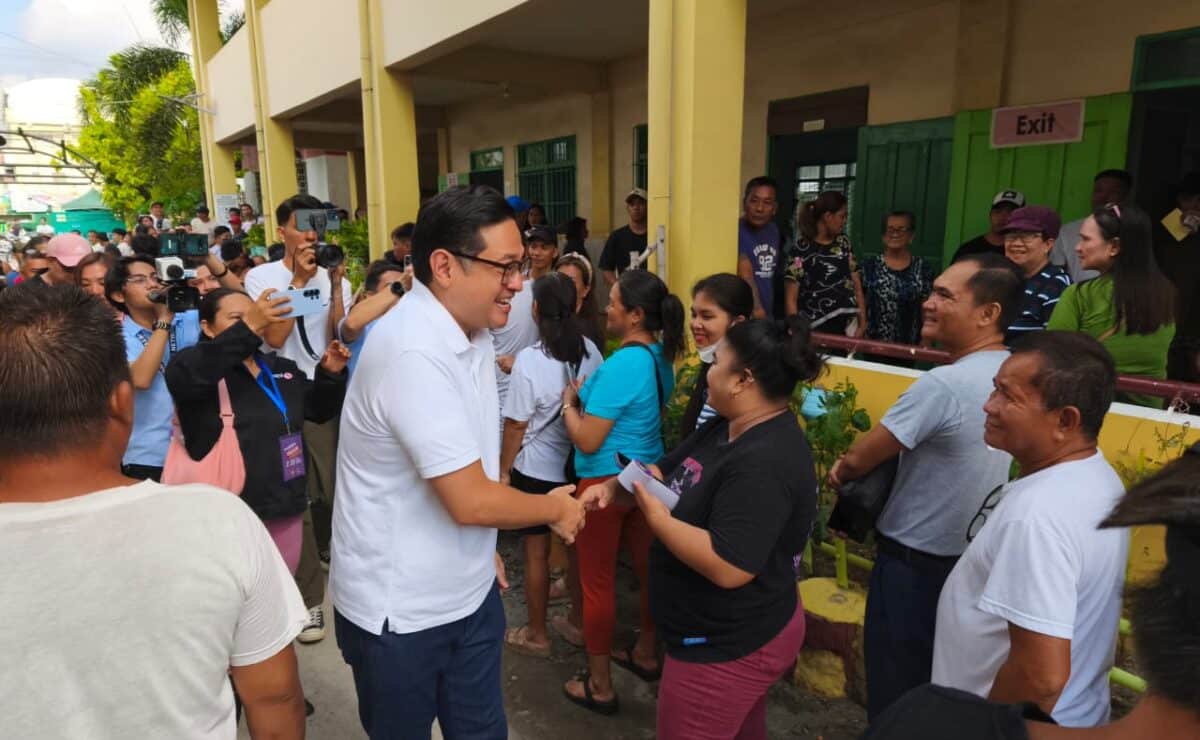 Senatorial bet Bam Aquino waits in line to cast his vote at South Central Elementary School in Concepcion, Tarlac He was enjoined by his wife Mary Fatima who were listed in precinct no. 0225 A, no. 90 clustered precinct. | PHOTO: Maria Adelaida Calayag