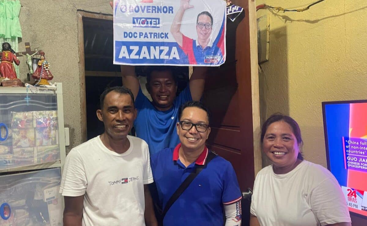 Former Catanduanes State University president Patrick Alain Azanza poses for a photo with his supporters on May 3, 2025. — Photo from Patrick Azanza/Facebook