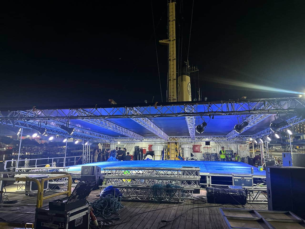 Volunteers prepare the stage for a sea concert that will be held in the waters off Pag-asa Island in the West Philippine Sea after departing Palawan on Tuesday, May 27. — Photo from Atin Ito/Facebook