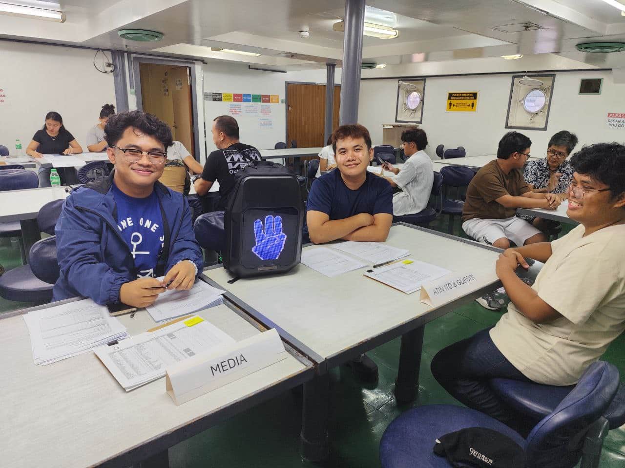 Atin Ito volunteers welcome on Sunday, May 25, members of media and other guests who will join them in their mission to the West Philippine Sea. — Photo from Atin Ito/Facebook