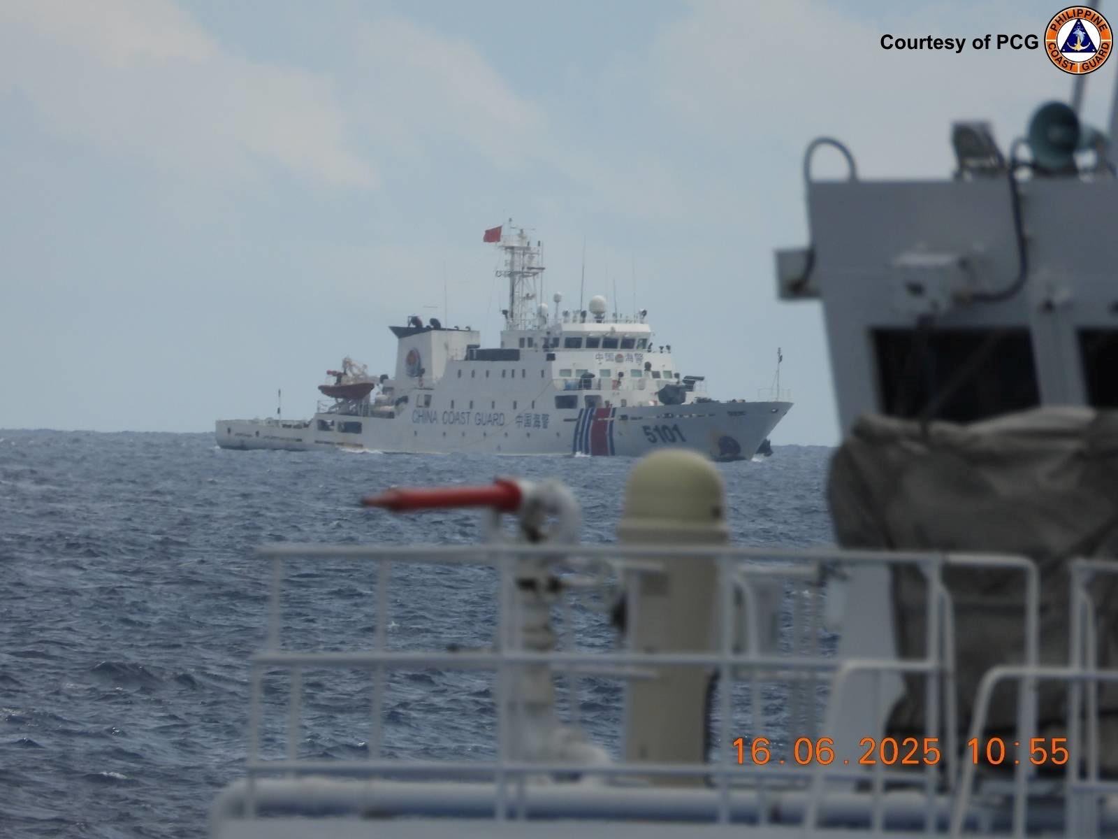 The Philippine Coast Guard (PCG) spots a China Coast Guard vessel near a Filipino ship on an operation to deploy floating aggregate devices in the West Philippine Sea on Monday, June 16, 2025. (Photo from the Philippine Coast Guard)
