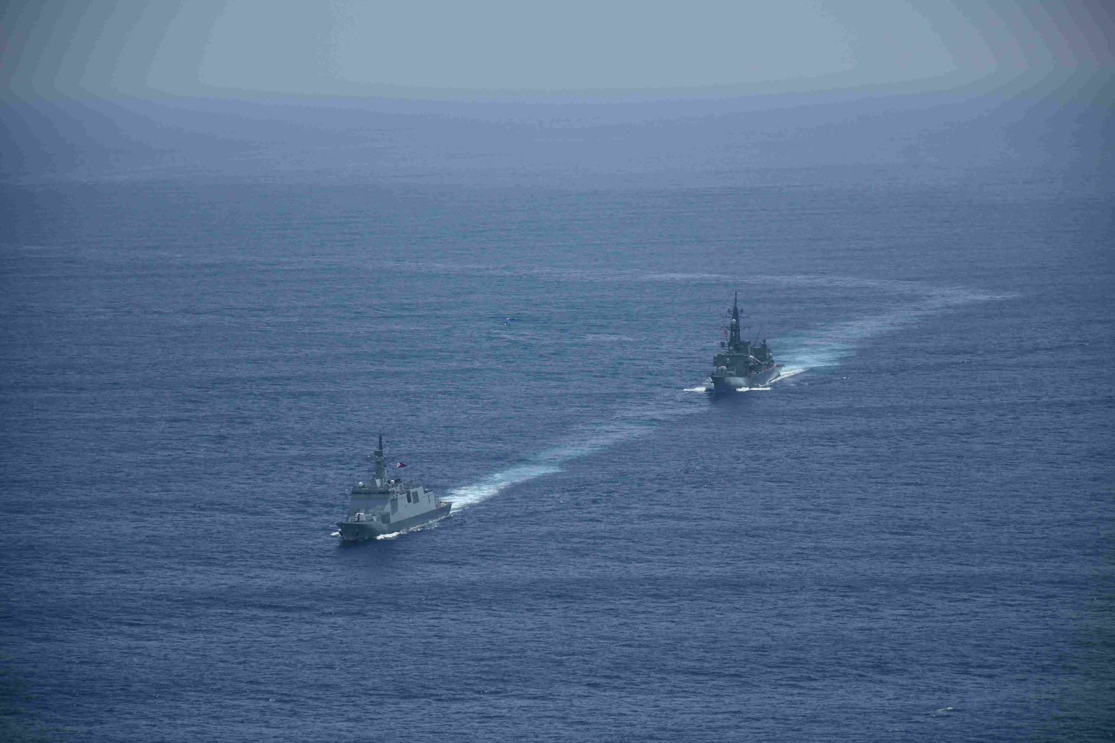 JS Takanami (DDG-110) and BRP Miguel Malvar (FFG-06) execute Division Tactics, maneuvering in close coordination as part of the Bilateral Maritime Cooperative Activity. (Photo courtesy of JMSDF)