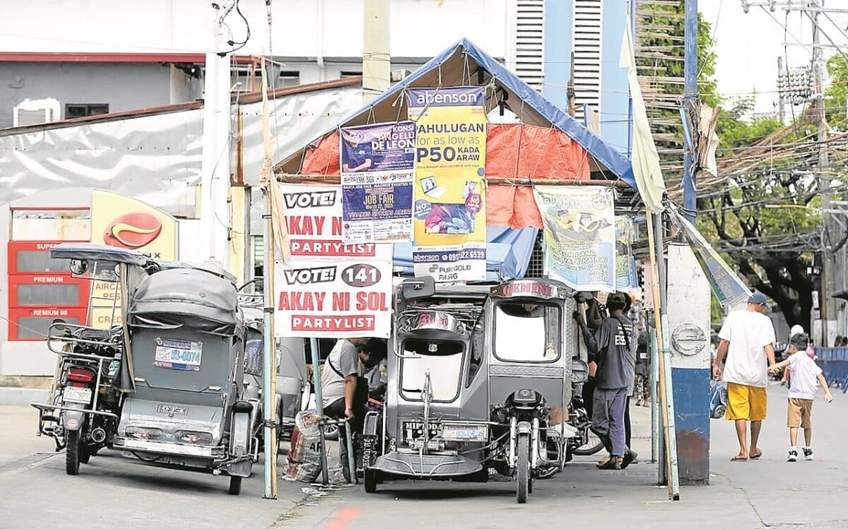 TERMINAL CASE A tricycle terminal near an elementary school in Barangay Pinagbuhatan, Pasig City, was allowed to be used as a common campaign poster area for the May 12 midterm elections. Photo taken on March 27.