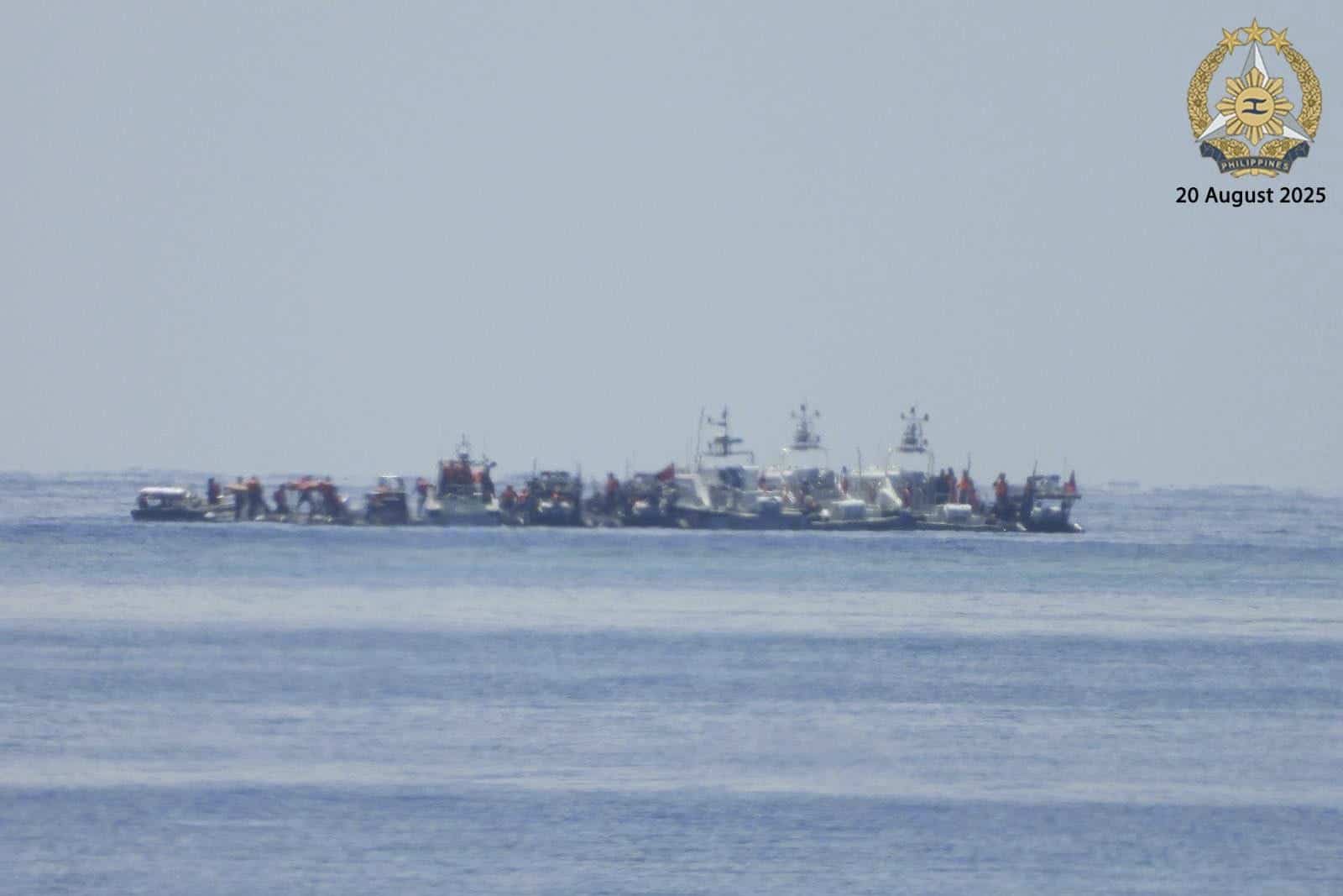 In this photo provided by the Armed Forces of the Philippines, Public Information Office (PAO), Chinese vessels, some mounted with armaments, were observed close to long-grounded Philippine warship BRP Sierra Madre in the vicinity of Second Thomas Shoal at the disputed South China Sea on Wednesday August 20, 2025. (Armed Forces of the Philippines PAO via AP)