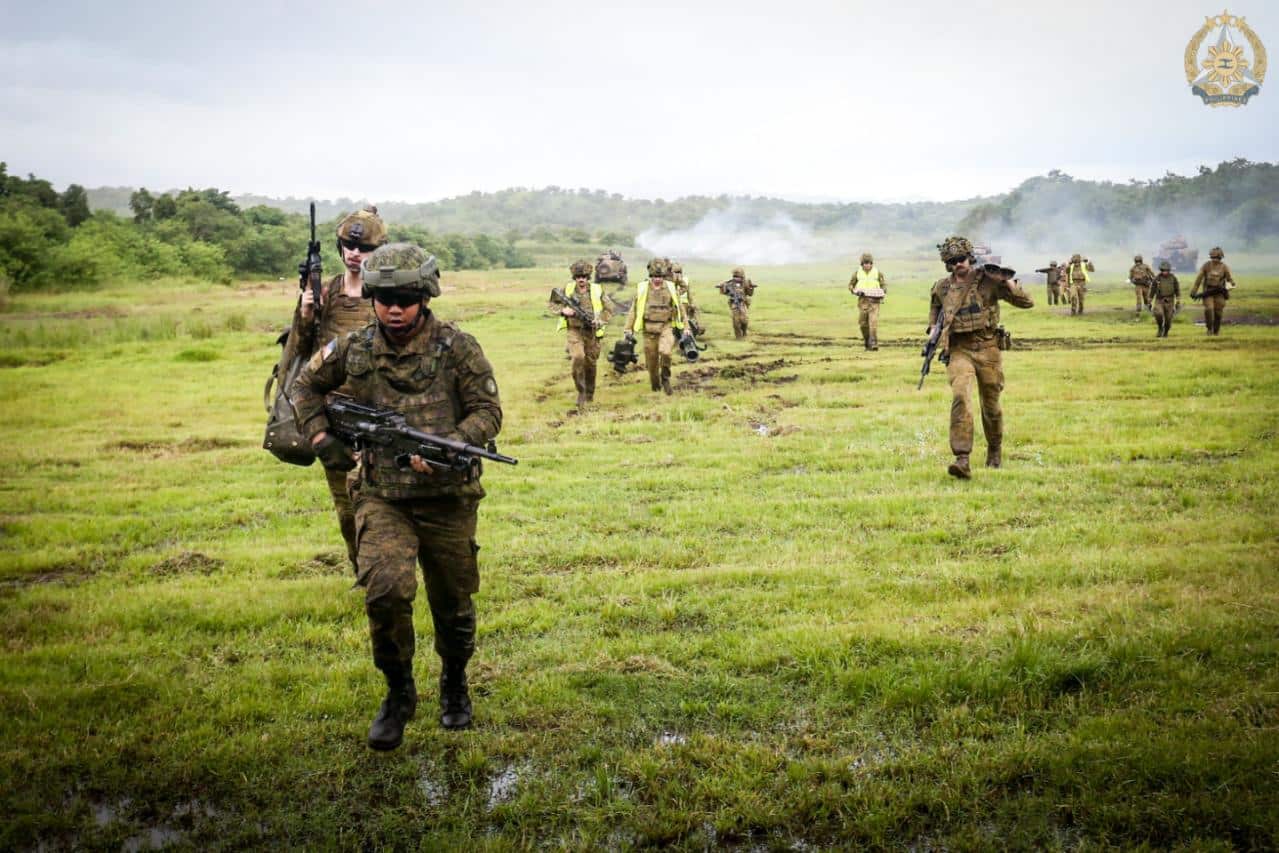 Philippine and Australian troops move out after completing the combined live-fire exercise under Philippine–Australia Exercise Alon 2025 at Fort Magsaysay, Nueva Ecija, on Wednesday, August 27, 2025. — Photo from Armed Forces of the Philippines Public Affairs Office
