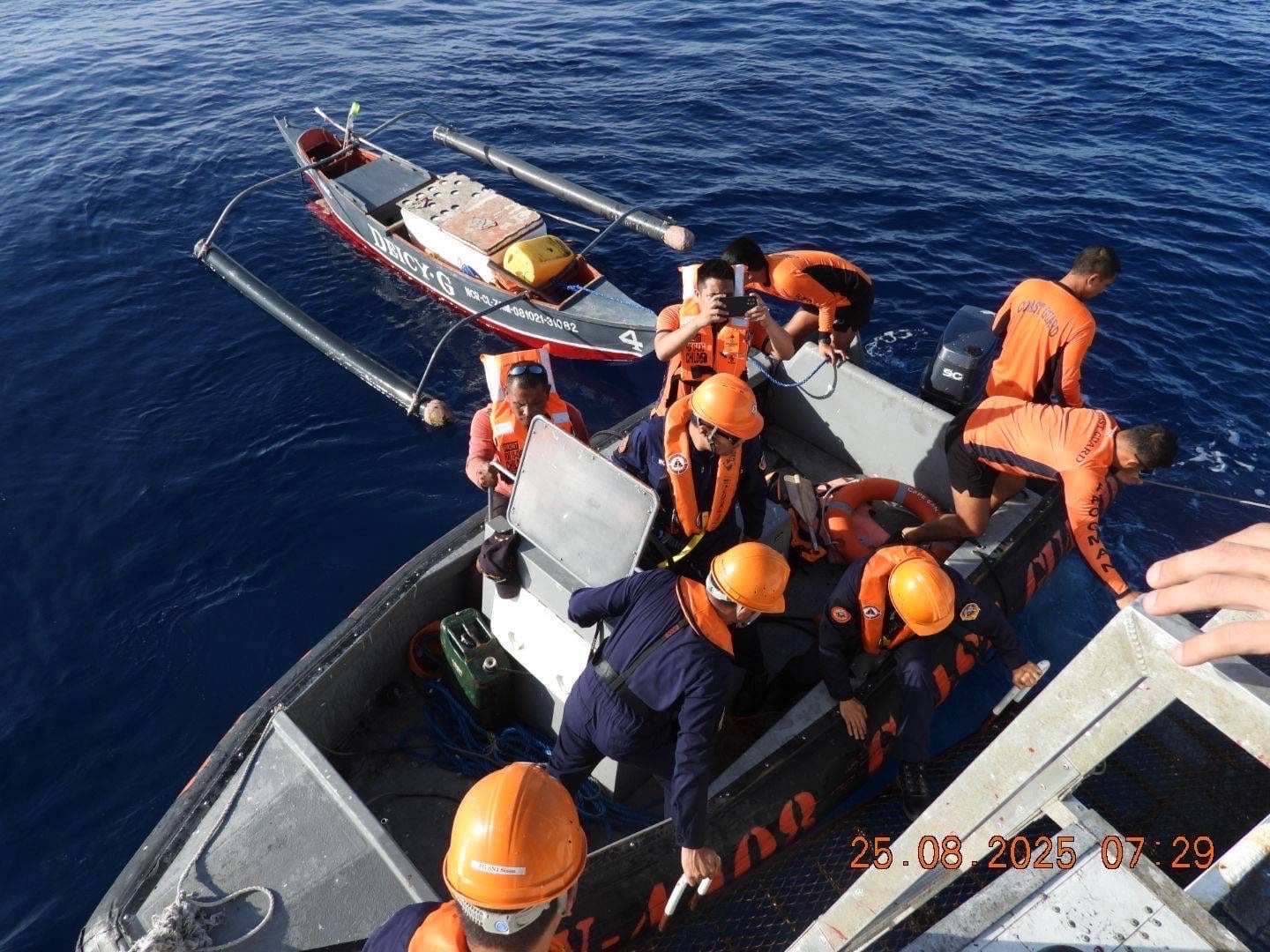 Rescued fisherman Roberto Alvior of Barangay Calapandayan, Subic is turned over to the Philippine Coast Guard vessel BRP Cape Agustin on Monday, Aug. 25. He was found by fellow fishermen after he went missing for days near Scarborough Shoal in the West Philippine Sea. 
