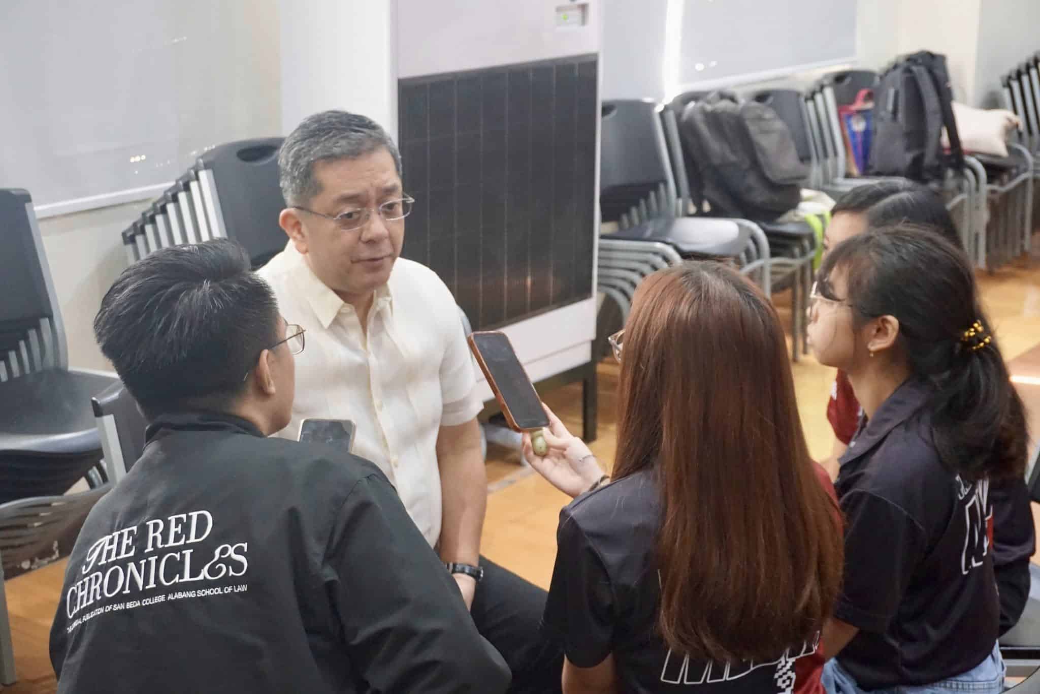 Commission on Elections Chair George Erwin Garcia is interviewed by campus journalists at San Beda College Alabang during his inspection of the sites of the Comelec's Special Register Anywhere Program on Tuesday, August 5, 2025. 