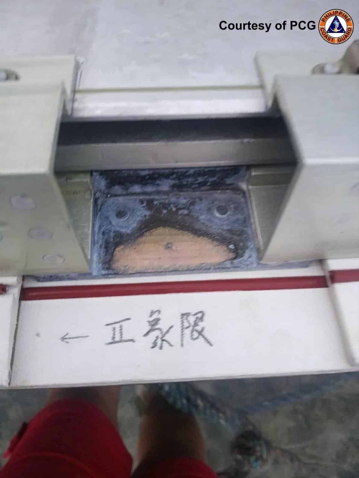 The Philippine Coast Guard recovers suspected rocket debris off Barangay Funda Bisucay Island in Cuyo, Palawan. The PCG believes the debris to be from China’s Long March-2C rocket launch on September 16. — Photo from PCG