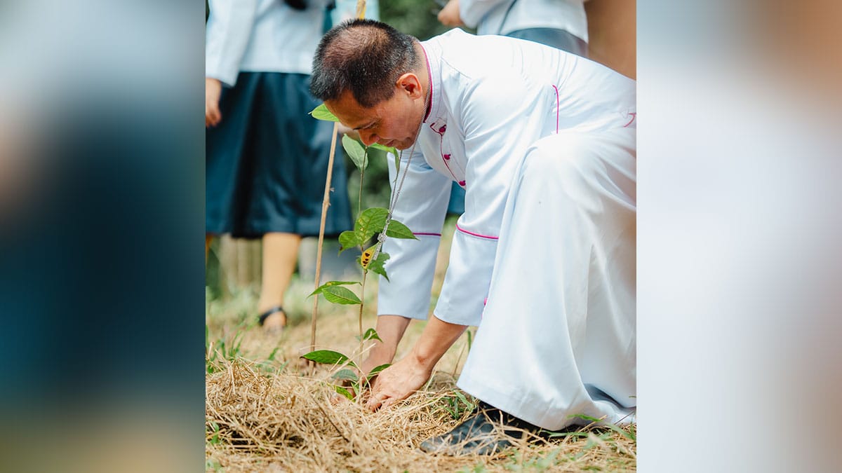 Tandag Bishop Raul Dael plants a tree during the Season of Creation 2025 event on October 11 in Barobo, Surigao del Sur. Photo courtesy of the Roman Catholic Diocese of Tandag