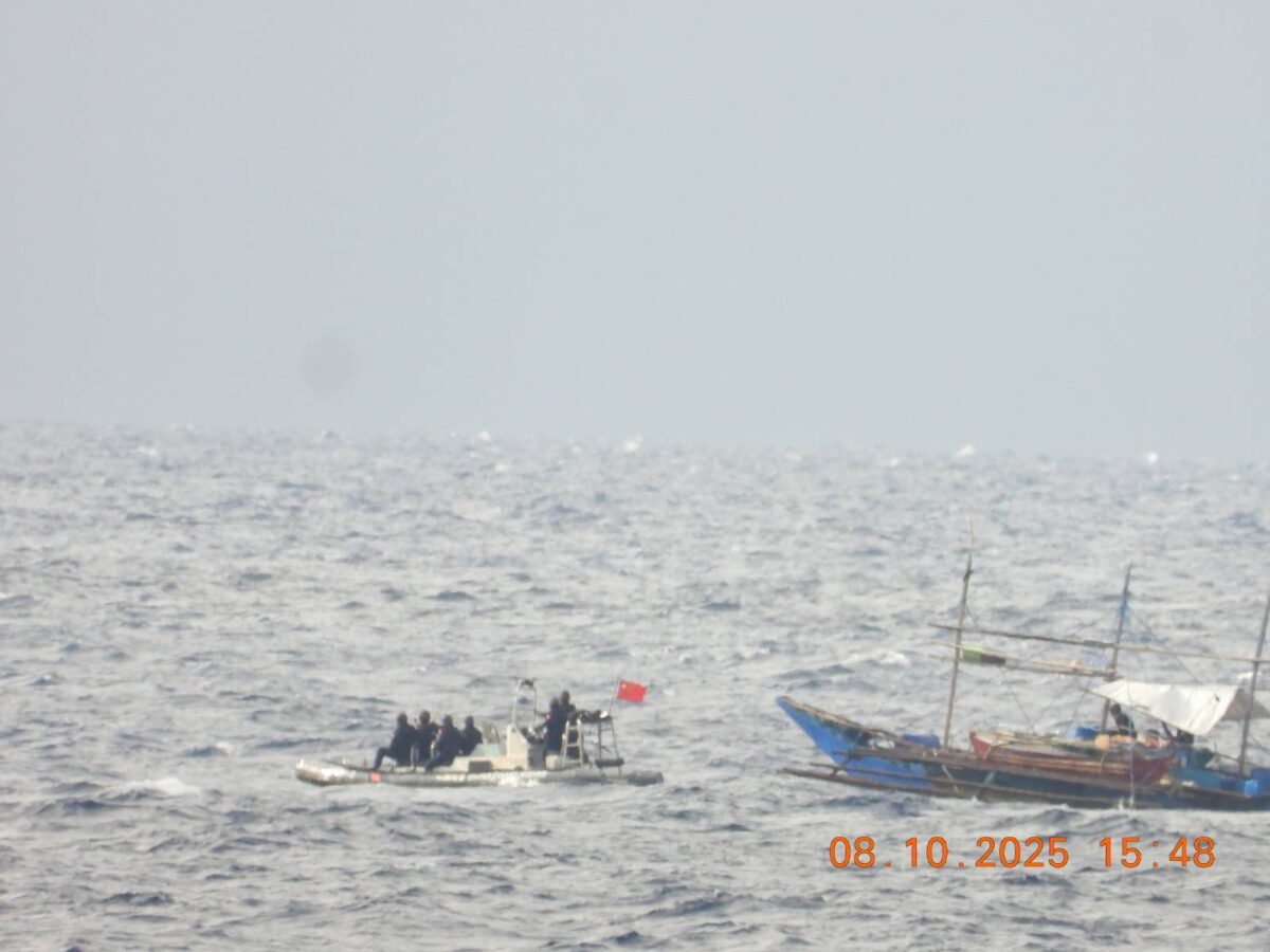 A Chinese boat approaching a Filipino fishing boat during an aid distribution activity in the West Philippine Sea on October 8, 2025. PHOTO FROM THE PHILIPPINE COAST GUARD