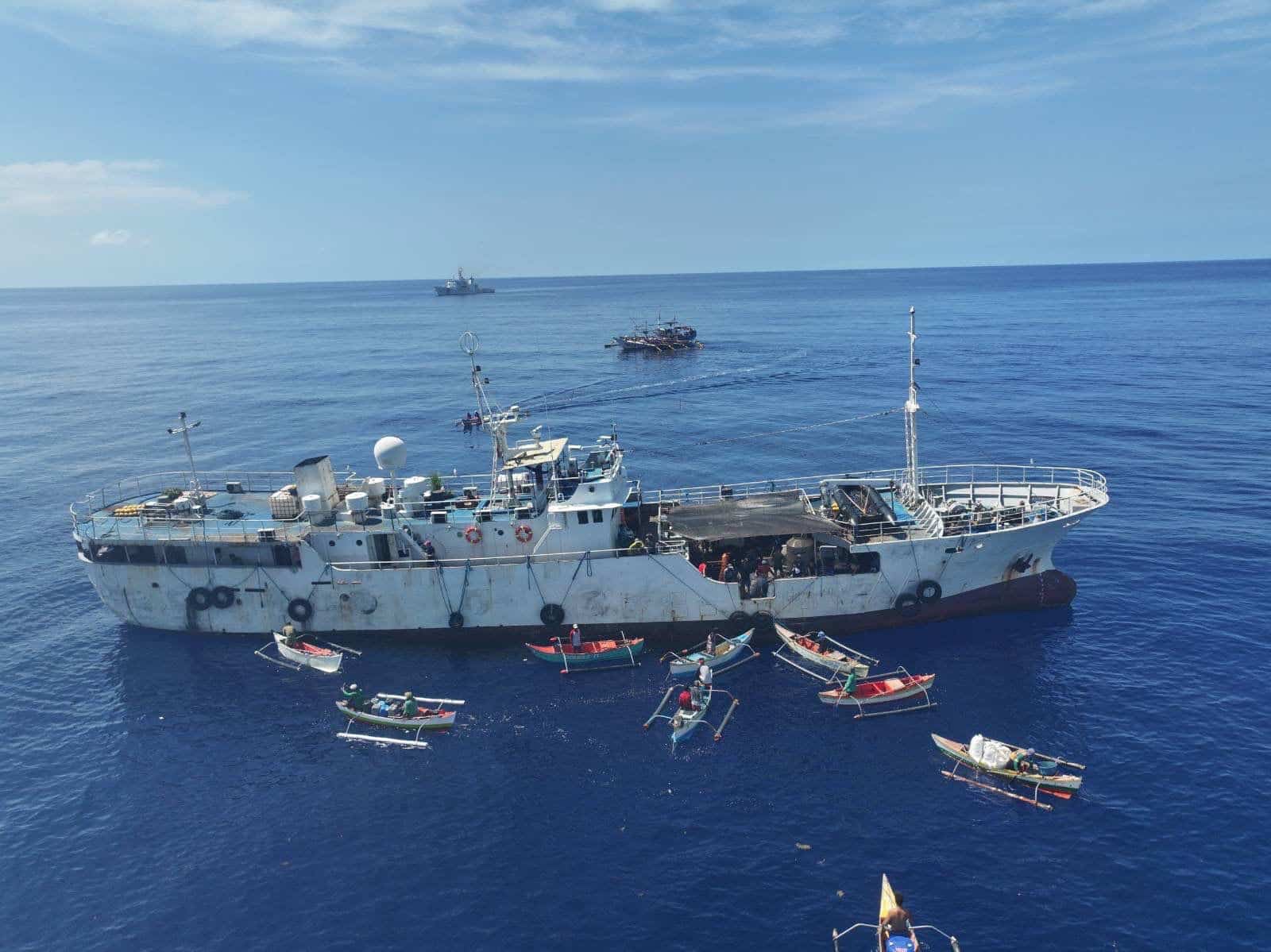 Filipino fishers near Scarborough Shoal await aid from a Philippine government ship on Monday, October 13, 2025. — Photo from the Philippine Coast Guard