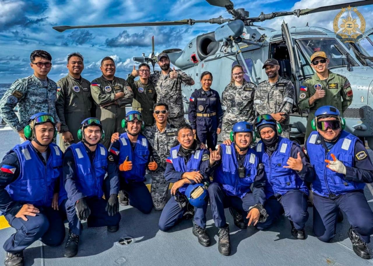 Philippine, New Zealand and Australian personnel pose for a group photo aboard BRP Jose Rizal (FF150) after completing a successful RHIB transfer. (Photo by Edward Bungubung)