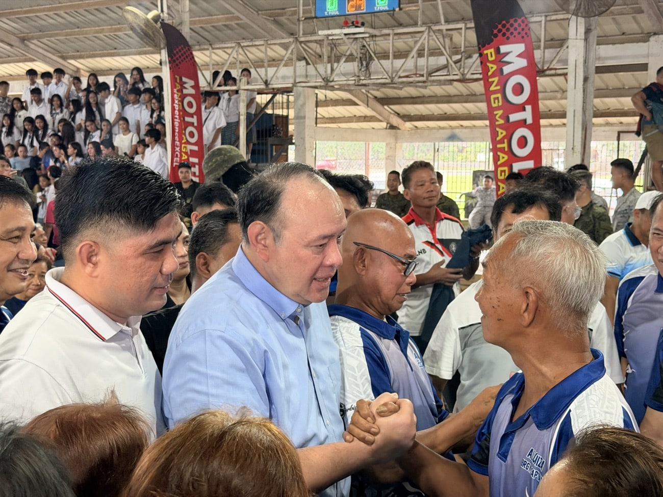 Defense Secretary Gilberto Teodoro Jr. distributed food packs, fish aggregating devices (payao), batteries, and fishing gear to local fishermen in Masinloc, Zambales on Friday. (Photo by Gabryelle Dumalag)
