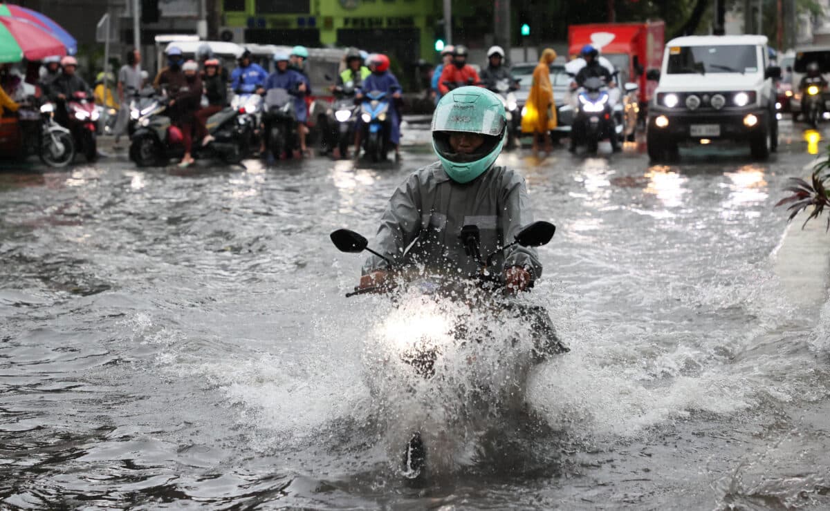 August 17 2026 BUENDIA MAKATI- Commuters seem like they were river crossing as they traverse a flooded portion of Buendia Ave., in Makati city on monday as heavy rains enhanced by Habagat have triggered class and work suspensions in many areas of Luzon. A Red Rainfall Warning has been raised over Metro Manila and six other areas in Luzon on Monday afternoon due to the effects of Southwest Monsoon or Habagat, state weather bureau PAGASA said. INQUIRER/ MARIANNE BERMUDEZ
